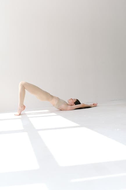 A woman in a serene yoga pose, bathed in soft, natural light